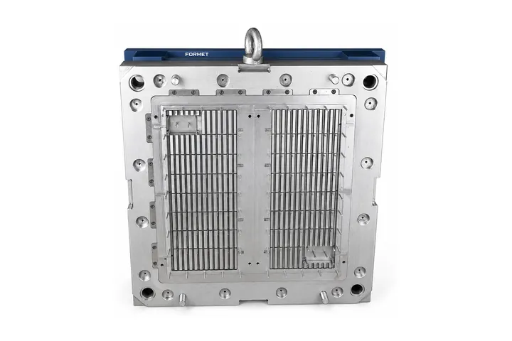 Mold cavity plate for a slotted grille panel with a lifting eye bolt