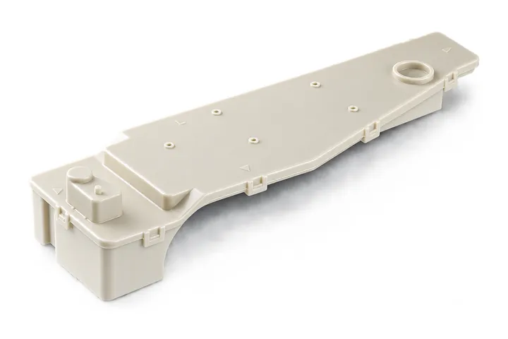 Long beige molded plastic housing with locating pins