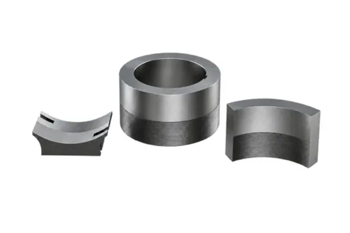 Hardened steel ring and two curved die segments