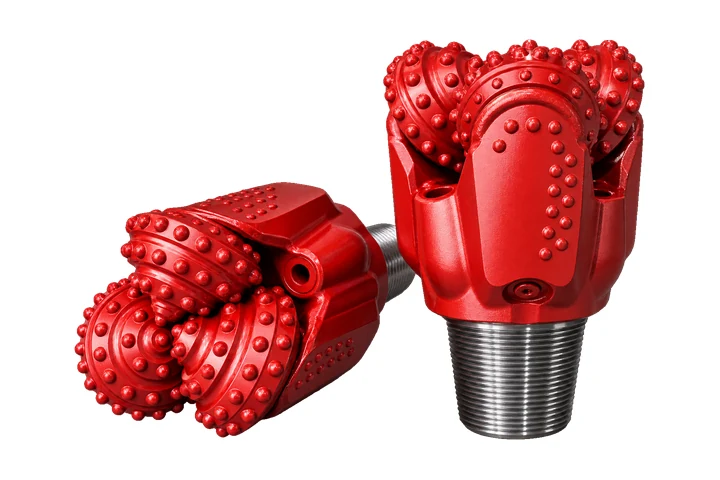 Red tricone roller bits with tungsten carbide inserts